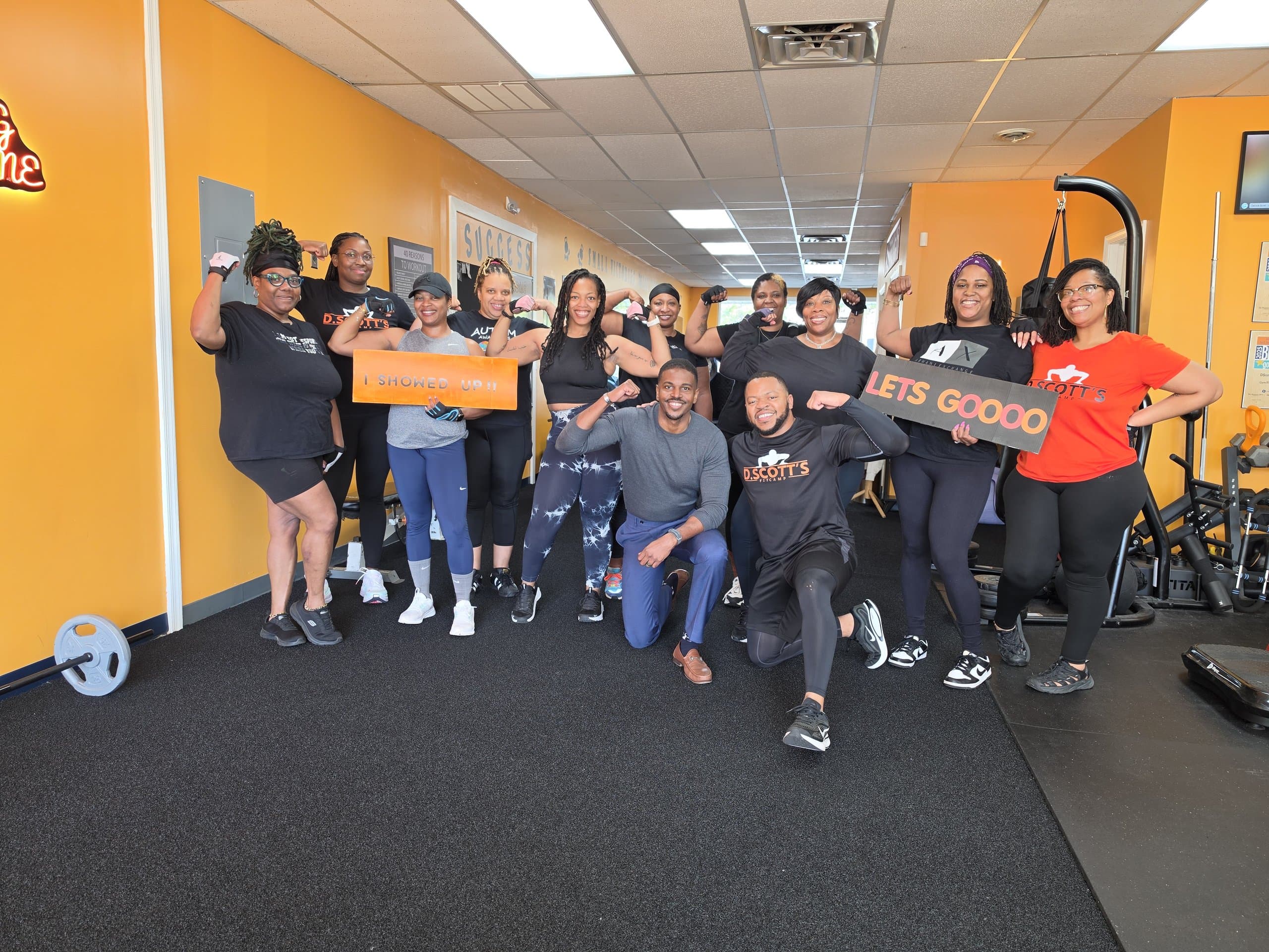 Members celebrating after a group workout at DScottsFitCamp in Newport News