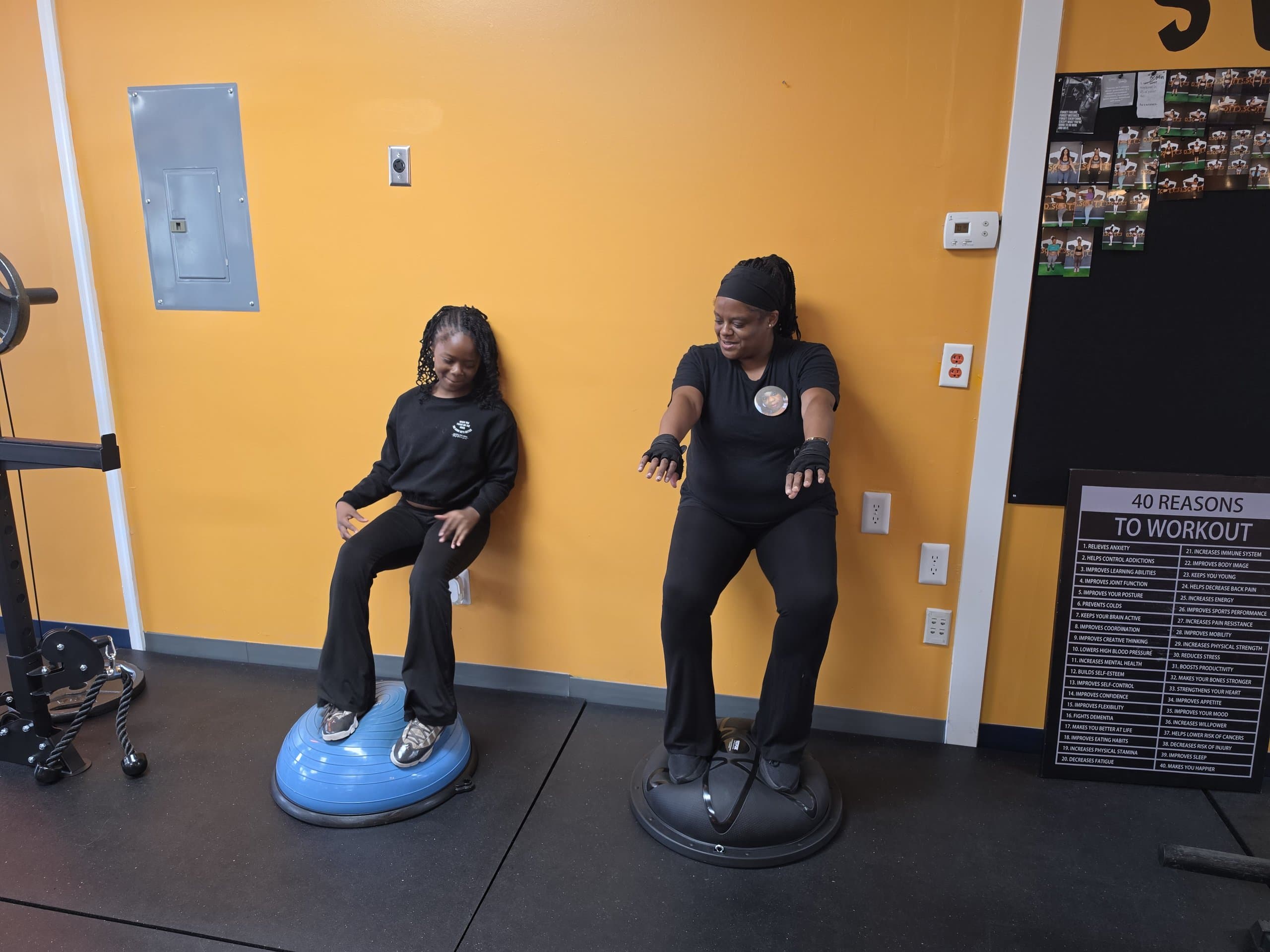 Members balancing on bosu balls at DScottsFitCamp in Newport News